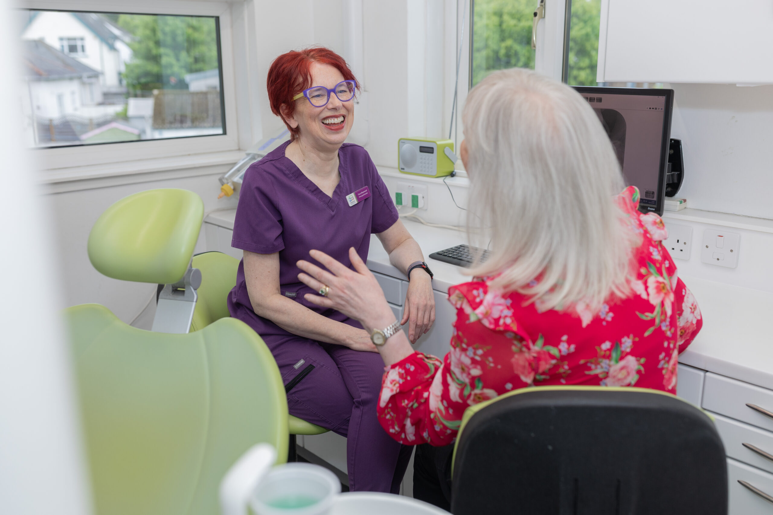 Dentist wearing purple gloves